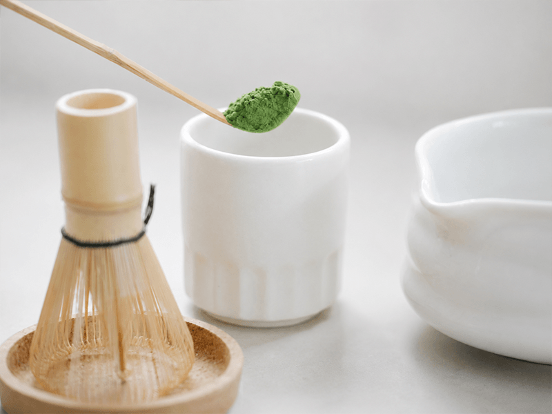 Matcha powder, bamboo whisk and tea bowl